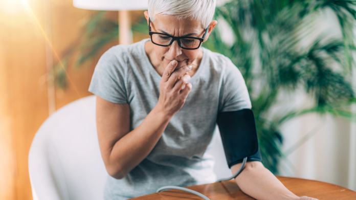 Woman taking her blood pressure